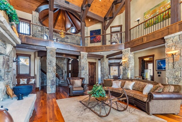 152 County Road 1040, Frisco, CO 80443 - living area featuring ornate columns, beamed ceiling, wood ceiling, hardwood / wood-style flooring, and high vaulted ceiling
