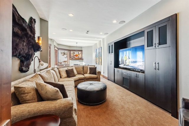 living room with recessed lighting and light colored carpet