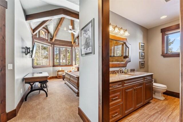 152 County Road 1040, Frisco, CO 80443 - bathroom with a ceiling fan, lofted ceiling with beams, vanity, baseboards, and toilet