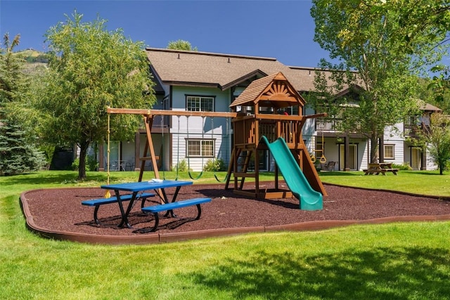 community playground featuring a lawn