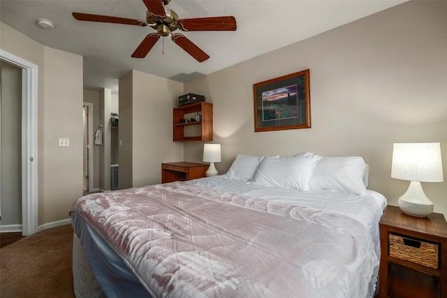 carpeted bedroom featuring a ceiling fan and baseboards