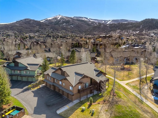 aerial view featuring a mountain view and a residential view