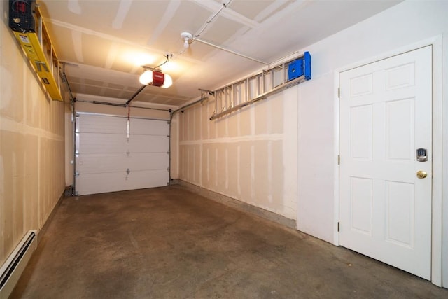garage featuring baseboard heating and a garage door opener