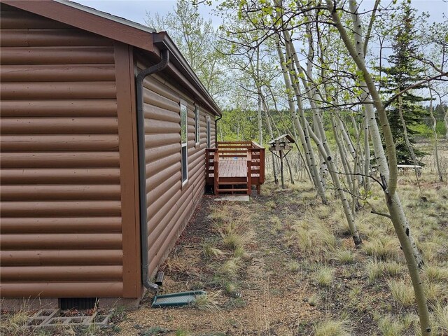 631 Arrowhead Dr, Como, CO 80456 - view of side of home featuring log veneer siding and a wooden deck