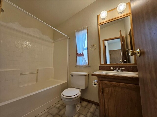 631 Arrowhead Dr, Como, CO 80456 - bathroom with toilet, vanity, bathtub / shower combination, baseboards, and tile patterned floors