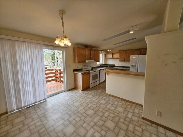 631 Arrowhead Dr, Como, CO 80456 - kitchen featuring white appliances, brick patterned floors, baseboards, under cabinet range hood, and lofted ceiling
