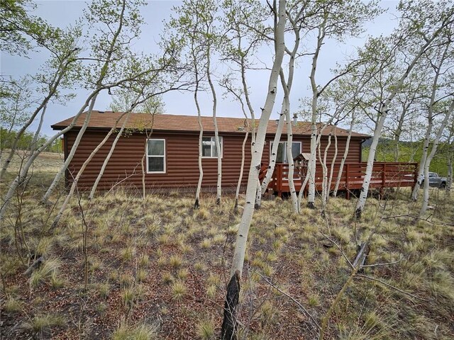 631 Arrowhead Dr, Como, CO 80456 - back of property with a wooden deck and roof with shingles