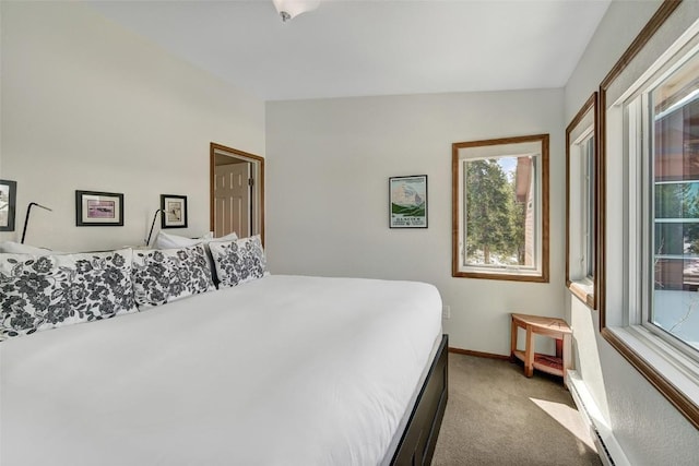 bedroom with carpet floors and baseboards