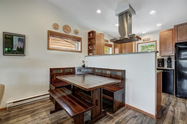 dining area featuring recessed lighting, wood finished floors, baseboards, and baseboard heating