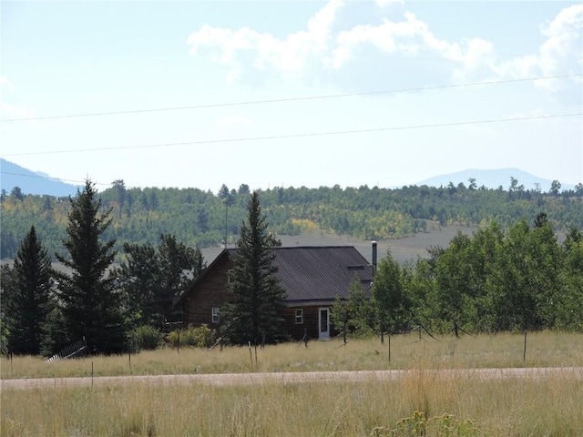property view of mountains with a forest view