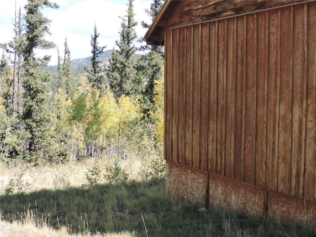 exterior space with a forest view