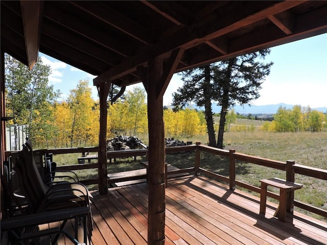 wooden terrace with a mountain view