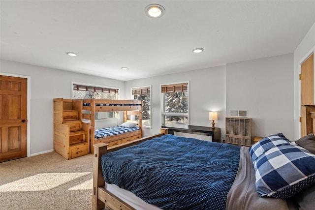 27145 Whitewood Dr E, Steamboat Springs, CO 80487 - bedroom featuring a barn door, carpet floors, recessed lighting, and baseboards