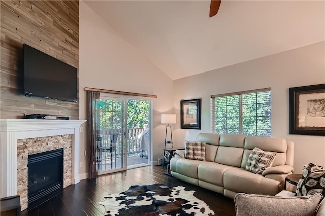 1437 Morgan Ct Unit 1437, Steamboat Springs, CO 80487 - living area featuring a stone fireplace, high vaulted ceiling, wood finished floors, and a ceiling fan