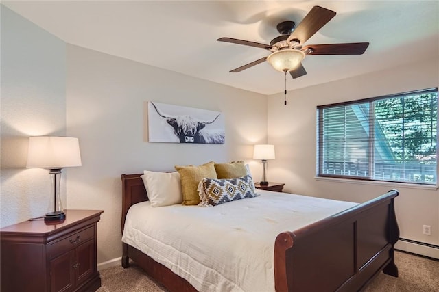 1437 Morgan Ct Unit 1437, Steamboat Springs, CO 80487 - bedroom with light carpet, baseboard heating, and a ceiling fan