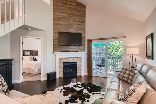 1437 Morgan Ct Unit 1437, Steamboat Springs, CO 80487 - living area with high vaulted ceiling, hardwood / wood-style flooring, and a fireplace