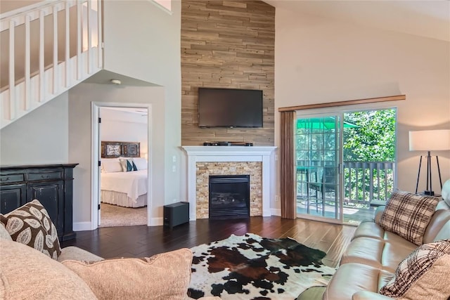 1437 Morgan Ct Unit 1437, Steamboat Springs, CO 80487 - living area with high vaulted ceiling, wood finished floors, a stone fireplace, and stairway