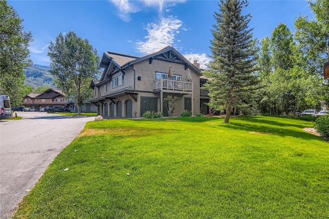 1437 Morgan Ct Unit 1437, Steamboat Springs, CO 80487 - view of front of property with a front yard, a balcony, and a chimney