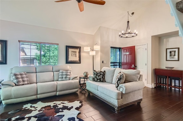 1437 Morgan Ct Unit 1437, Steamboat Springs, CO 80487 - living room with a chandelier, a ceiling fan, dark wood-type flooring, and a high ceiling