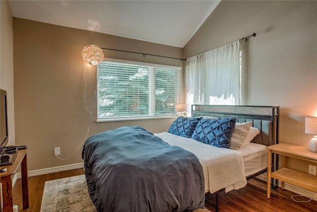 101 Blue Grouse Ln Unit D, Silverthorne, CO 80498 - bedroom with vaulted ceiling and wood finished floors