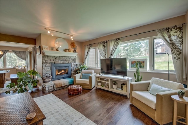 101 Blue Grouse Ln Unit D, Silverthorne, CO 80498 - living room with a fireplace, plenty of natural light, wood finished floors, and rail lighting