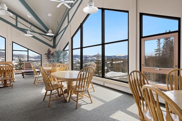 2200 Lodgepole Cir Unit 204, Silverthorne, CO 80498 - dining room with high vaulted ceiling, carpet floors, a ceiling fan, and a mountain view