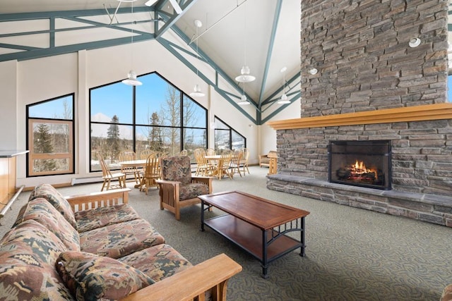 2200 Lodgepole Cir Unit 204, Silverthorne, CO 80498 - carpeted living area featuring high vaulted ceiling and a fireplace