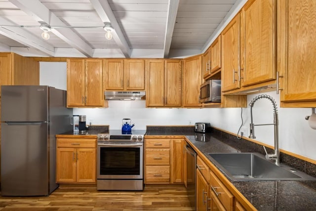 2200 Lodgepole Cir Unit 204, Silverthorne, CO 80498 - kitchen with stainless steel appliances, beam ceiling, wood finished floors, and a sink
