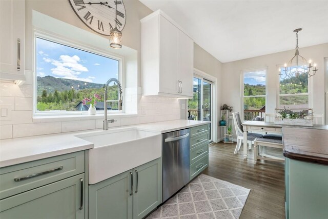 30600 Ormega Way, Oak Creek, CO 80467 - kitchen with dishwasher, a sink, light wood-style flooring, a chandelier, and green cabinetry