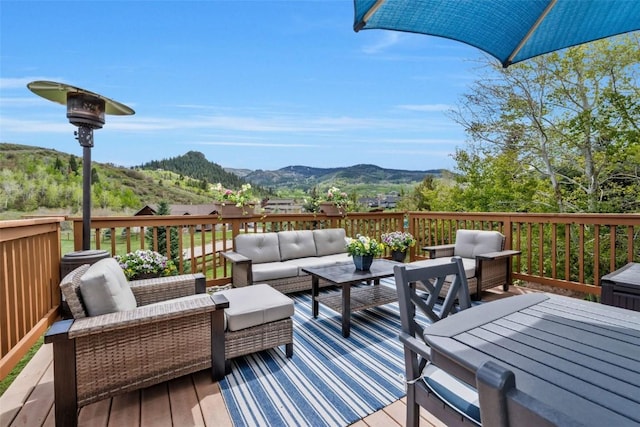 30600 Ormega Way, Oak Creek, CO 80467 - wooden terrace featuring an outdoor living space and a mountain view