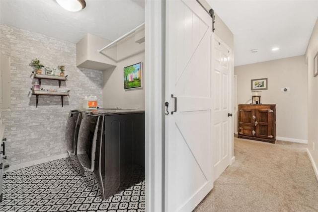 30600 Ormega Way, Oak Creek, CO 80467 - laundry area with washer and clothes dryer, baseboards, and a barn door