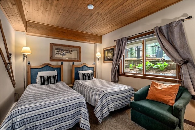 carpeted bedroom featuring beam ceiling and wooden ceiling