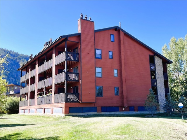 view of building exterior featuring a mountain view