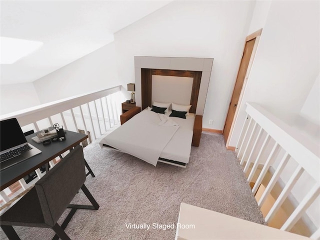 bedroom with lofted ceiling and carpet flooring