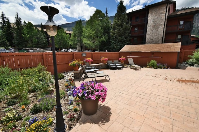 view of patio featuring fence