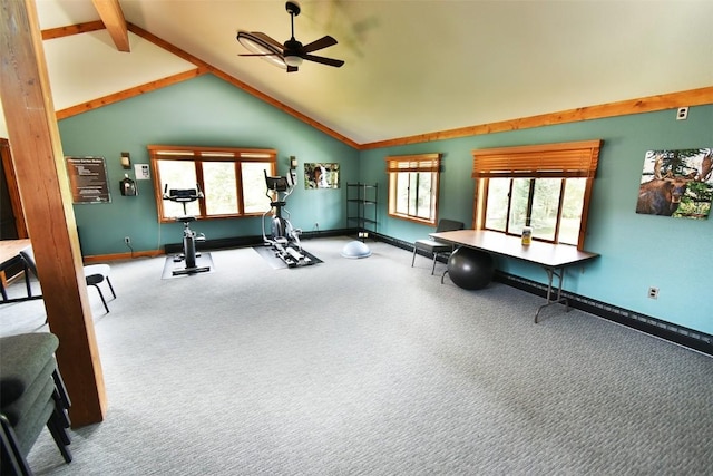 workout area with baseboards, lofted ceiling, a ceiling fan, and carpet
