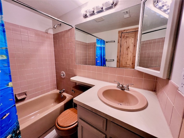 full bathroom featuring vanity, tile walls, shower / tub combo, backsplash, and toilet