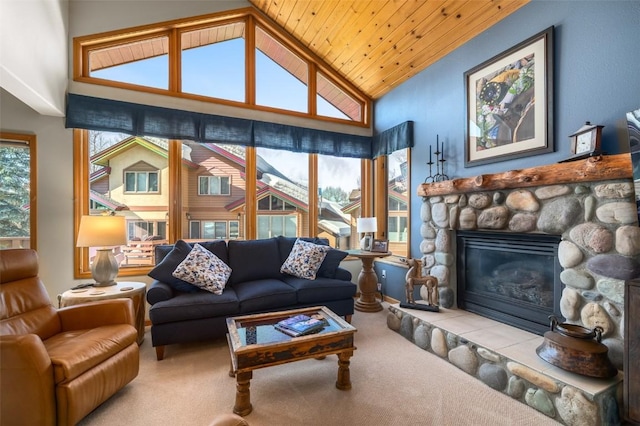 2838 Kitzbuhel Court ., Steamboat Springs, CO 80487 - living area featuring wooden ceiling, a stone fireplace, carpet, and high vaulted ceiling