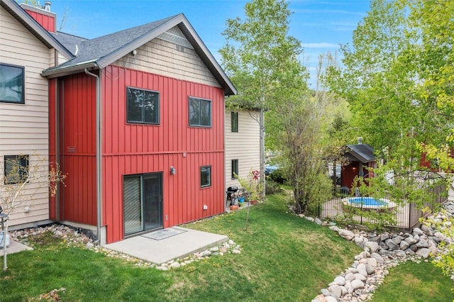 3462 Sunburst Ct Unit 36, Steamboat Springs, CO 80487 - back of house featuring board and batten siding and a lawn