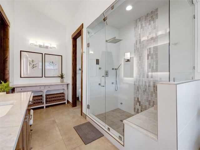 304 Raven Golf Ln, Silverthorne, CO 80498 - bathroom with vanity, a stall shower, tile patterned floors, and recessed lighting