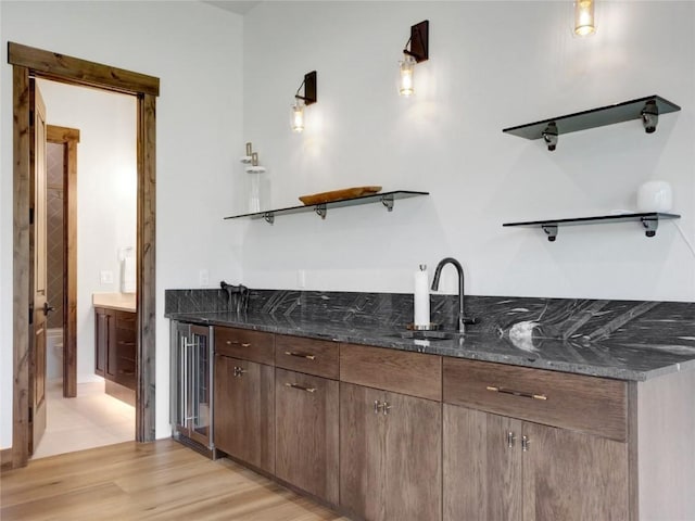 304 Raven Golf Ln, Silverthorne, CO 80498 - indoor wet bar featuring wine cooler and light wood finished floors