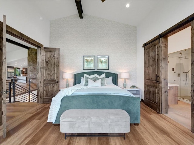 304 Raven Golf Ln, Silverthorne, CO 80498 - bedroom featuring a barn door and wood finished floors