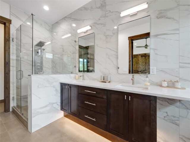 304 Raven Golf Ln, Silverthorne, CO 80498 - bathroom featuring tile walls, double vanity, a marble finish shower, recessed lighting, and ceiling fan