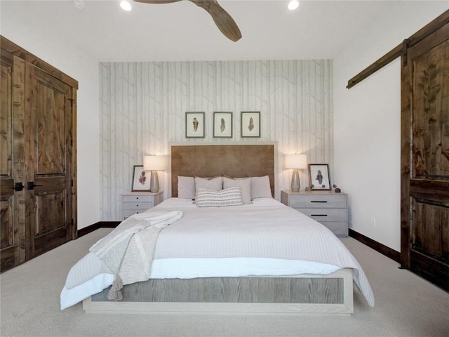 304 Raven Golf Ln, Silverthorne, CO 80498 - carpeted bedroom featuring a barn door, ceiling fan, and recessed lighting