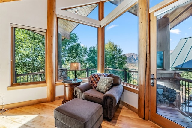 731 Lakeview Cir, Silverthorne, CO 80498 - sunroom with baseboards, a mountain view, wood finished floors, healthy amount of natural light, and vaulted ceiling