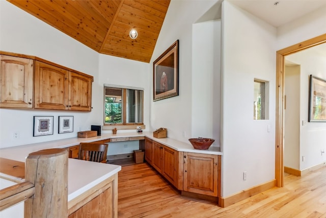 731 Lakeview Cir, Silverthorne, CO 80498 - kitchen featuring light wood finished floors, light countertops, vaulted ceiling, wood ceiling, and a peninsula