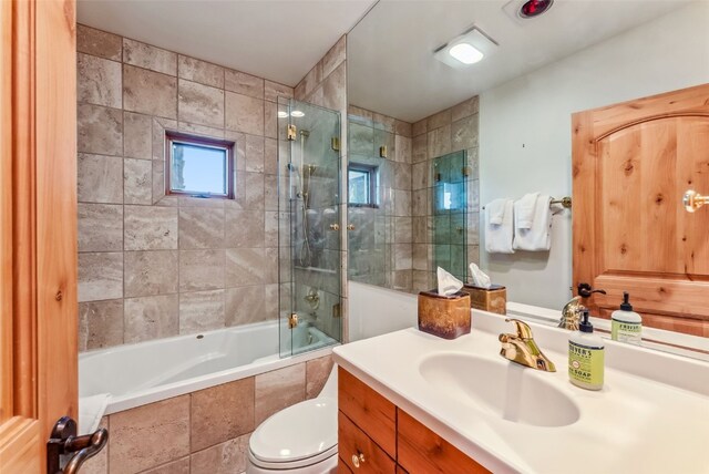 731 Lakeview Cir, Silverthorne, CO 80498 - bathroom with tiled shower / bath, vanity, and toilet