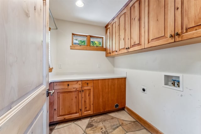 731 Lakeview Cir, Silverthorne, CO 80498 - washroom with cabinet space, washer hookup, hookup for an electric dryer, baseboards, and light stone finish flooring