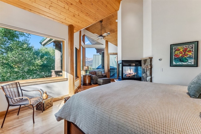 731 Lakeview Cir, Silverthorne, CO 80498 - bedroom featuring wood ceiling, a fireplace, wood finished floors, and high vaulted ceiling