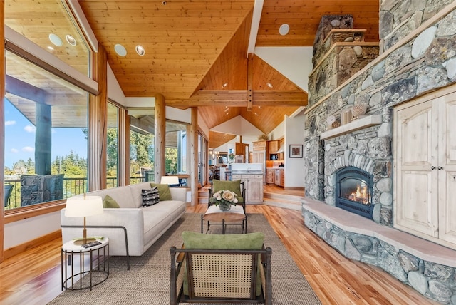 731 Lakeview Cir, Silverthorne, CO 80498 - living room with wood finished floors, a fireplace, baseboards, and high vaulted ceiling
